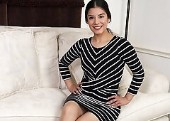 Stylish long-haired brunette Lili Rein opens her shaved pussy