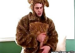 Pornstar masturbating his thick dick in  bear suit