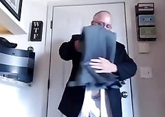 Business bear strips down after a hard day at the office