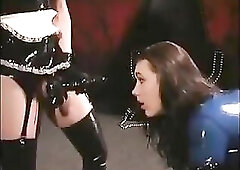 2 lesbo playing in rubber with a ding-dong