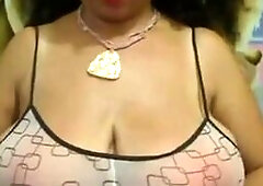 Big-Breasted Black Mature Woman Shows Off on Webcam