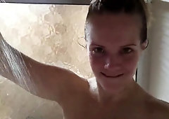Stacked brunette teen fingers her hairy cunt in the shower