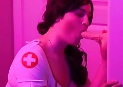 Hot nurse crossdresser sucks a dildo and toys her ass