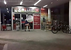 Crossdresser plays with dildo in public