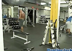 Ripped gym jocks going down on cock