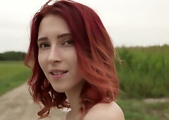 Elin the redhead teases alone on a wooden bridge and secluded grassy spots