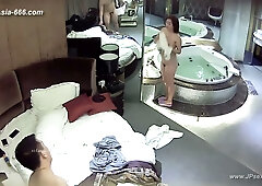 Young Chinese wife unknowingly filmed by hidden camera as she and her husband make love in their bedroom