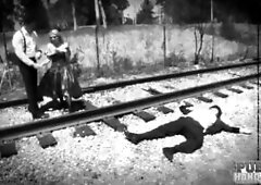 Silent movie star in peril Christie Stevens jerks cock on railroad tracks