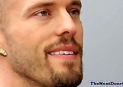 Inked hunk stroking his hard prick