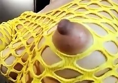 Provocative brunette in fishnets shows off her big nipples