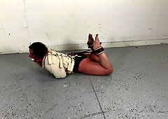 Fayth on Fire in a Posey straitjacket, ball gagged, and hogtied