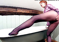 red hard-core toying with her pussy while in pantyhose