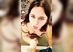 A cute teen play with a realistic sex tool, sucking it and banging with it