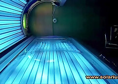 Alone in a sun-drenched rooftop solarium a young woman lets her hands wander over her body while hidden cameras capture every intimate touch