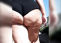 Exhibitionist wife walking and flashing large butt in public once more
