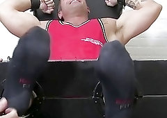 Dominated hunk has his feet worshiped