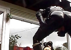 Perverted transsexual freak in leather suit plays freaky breathing game