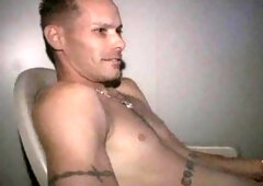 Adventurous tattooed guy indulges in anonymous glory hole blowjobs during lunch break