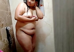My curvy girlfriend flaunting her juicy booty in the shower for her man