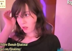 brunette trans cutie in black fishnet stockings strokes her nice cock