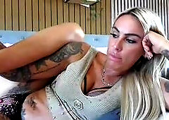 Tattooed Blonde Teases on Couch