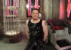 Dominatrix And Slave Boy In Dungeon