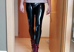 Crossdresser taunting in shining Stretch Pants and Stilettos