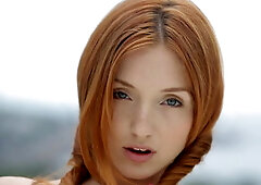 Young redhead teen Michelle posing