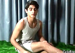 Good-looking twink posing at the studio