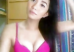 Adorable Asian tranny strokes her big beef bayonet on webcam