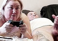 This guy interrupted his stepmom's game on the console, banged her in her throat and finished in it