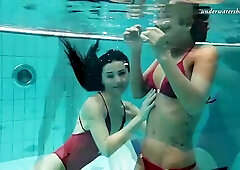 Frisky girls got naked in the swimming pool and had some fun while no one was watching