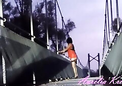 Exibiting on pedestrian bridge at sunrising. Clothed as a whore for u. A wetlook suit with my anal tail plug filling my anal opening I had to void uri