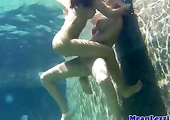 Lezdom horny dykes scissoring in outdoor pool