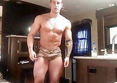 Gorgeous police officer stripping off his uniform