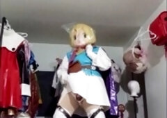 Gracidea in Kigurumi cosplay and PVC mask enjoying some breathplay from two angles