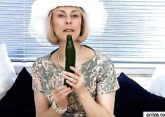 Anilos Hazel bangs her cougar twat with a lengthy green cucumber