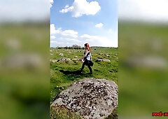 British redhead MILF films herself topless on an Easter walk outdoors