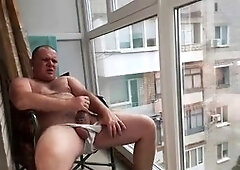 flashing off by the window smoking