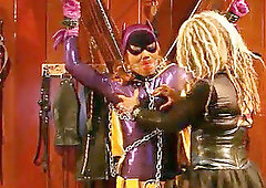 Batgirl in restrain bondage