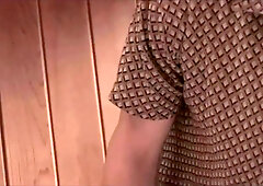 Super-cute viewing of pornography on the smartphone under the grimacing of the lollipop