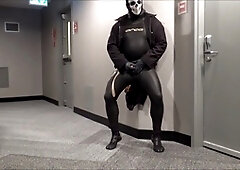 Jerking off in in hotel hall in wetsuit