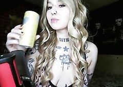 Goth blond drinking and burping