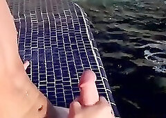 Near the pool blonde twink Tyler Thayer jerks his cock