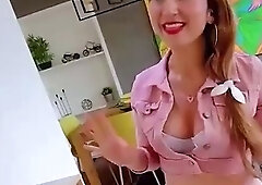 Busty redhead gives a scorching handjob and demonstrates