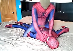 hooded spiderman fights against spiderman