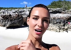 Stunning bikini babe poses for photoshoot on the beach