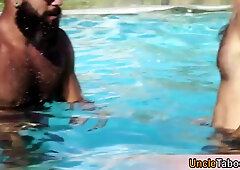 Muscle hunk pleasing big dick bareback at the poolside