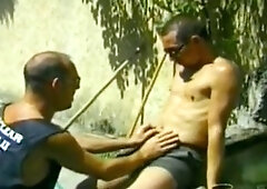 three hunks blow outdoors