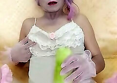 Oanh Le transgender wearing sexy porn clothes playing with a fake can